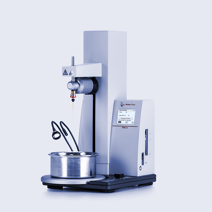 Anton Paar Penetrometer PNR 500 with needle probe and metal sample cup in place, showing completed test on touchscreen.